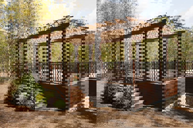 Patio with Reveal stairs and a pergola