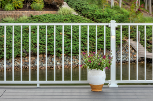 White aluminum railing on a grey composite deck.