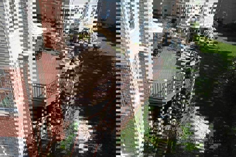 High elevation deck attached to a brick house