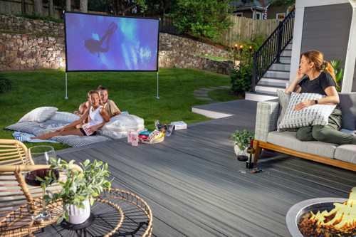 Patio With Family Enjoying Outdoor Movie