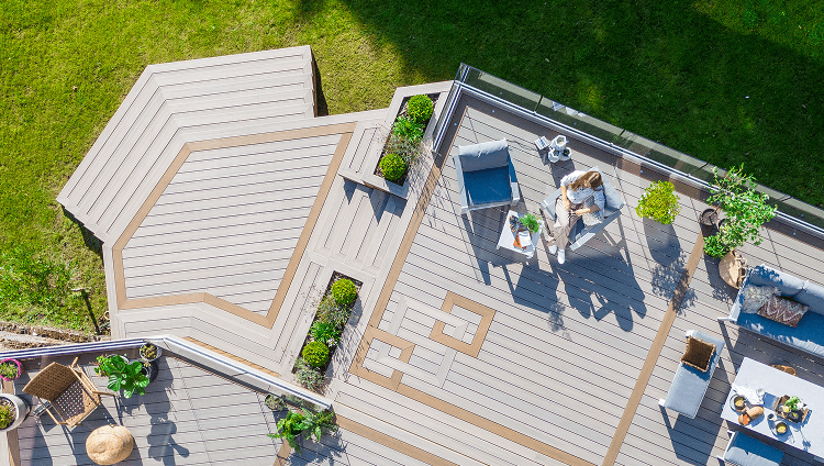 Image Ideas Category Overhead Shot Of Person Relaxing On A Composite Deck With Intricate Design 2X
