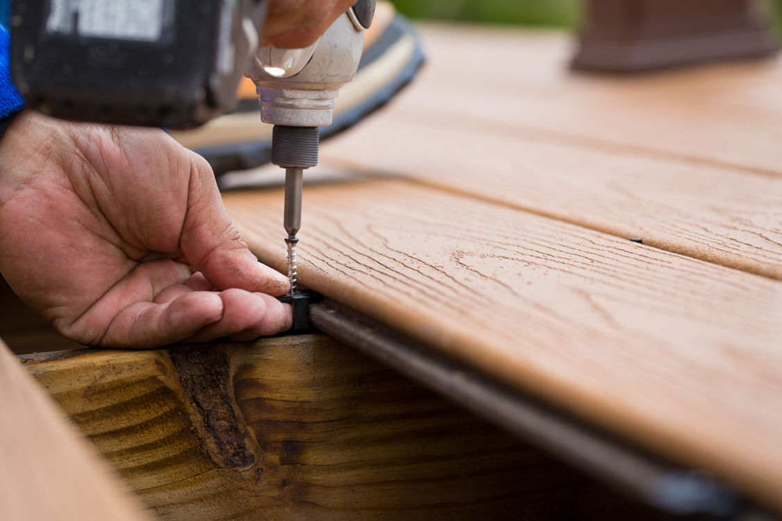 Drilling a screw by a hand drill